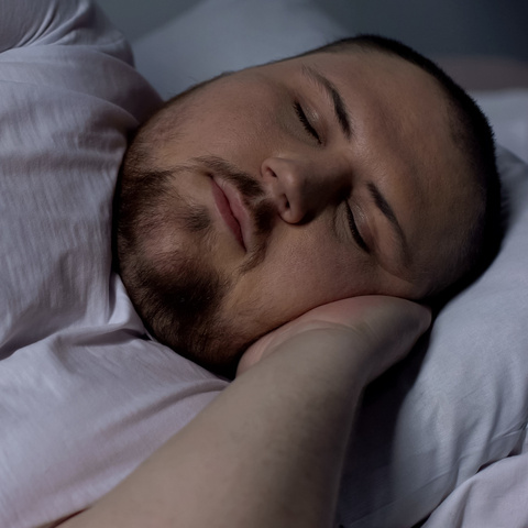 Man with excess weight sleeping